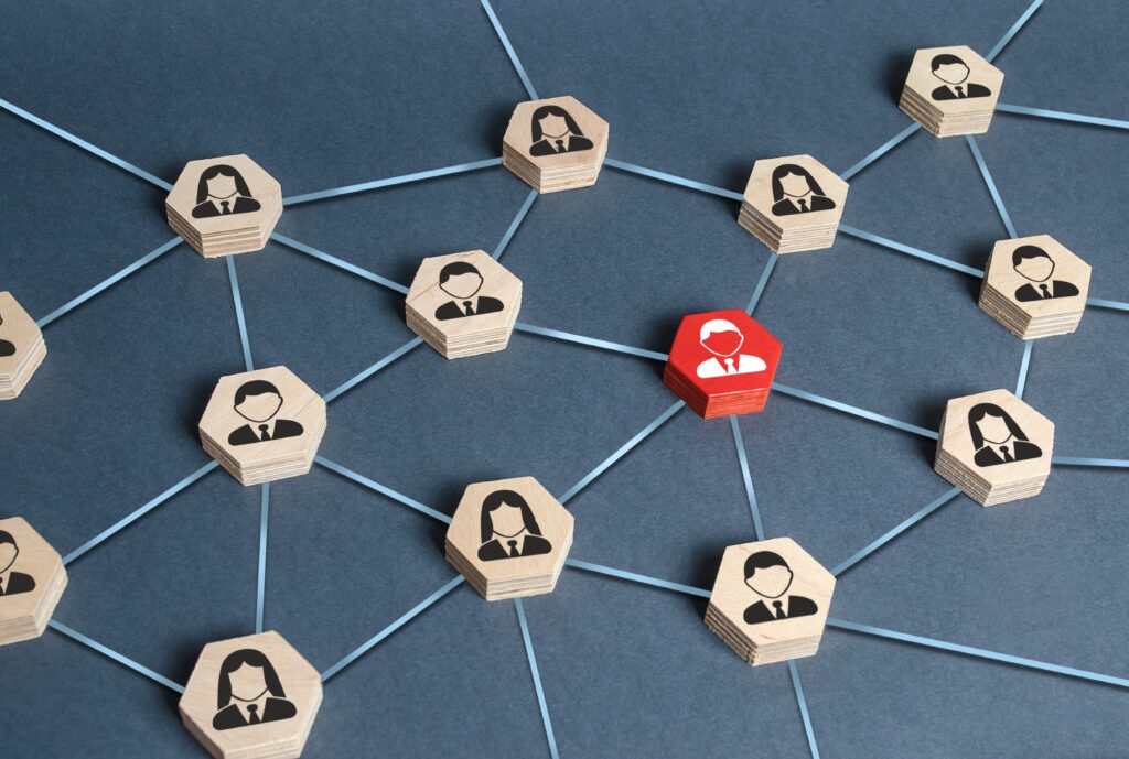 Hexagons with businessmen employees are connected with their leader by a business network. Communication and social networks. Cooperation and collaboration. Project and leadership personnel management