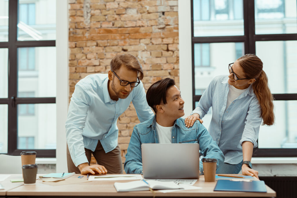 Business people teamwork on laptop in modern office