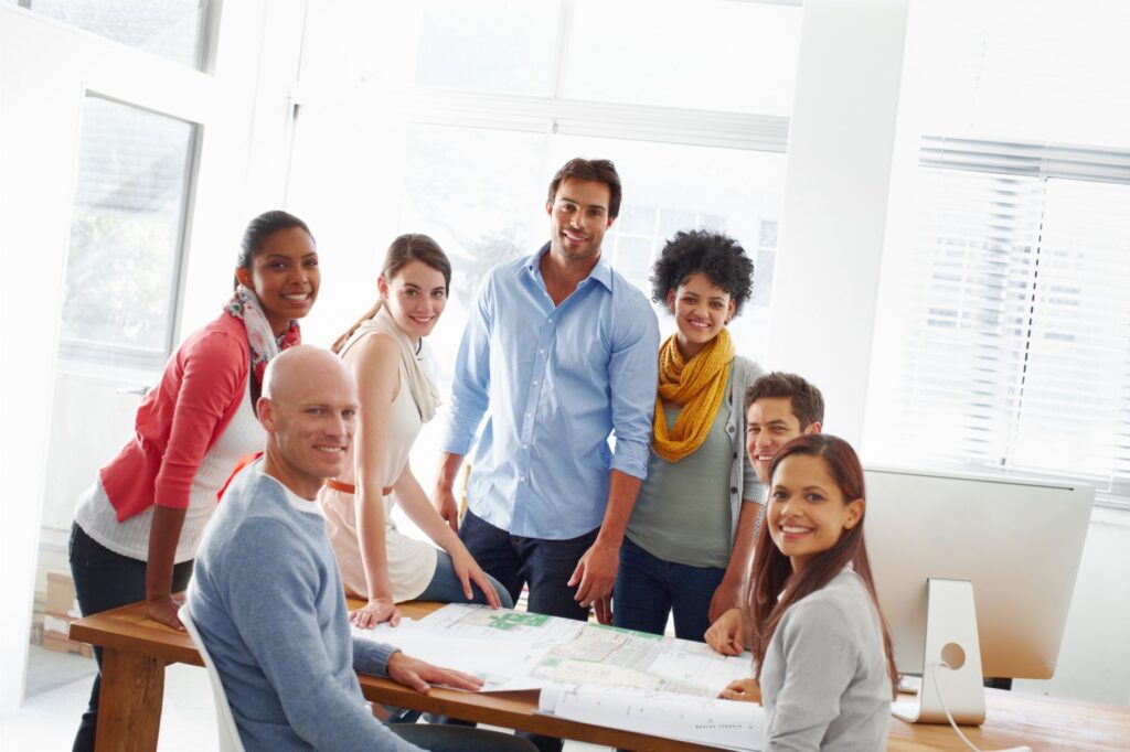 Happy diverse team posing for a group picture in the office